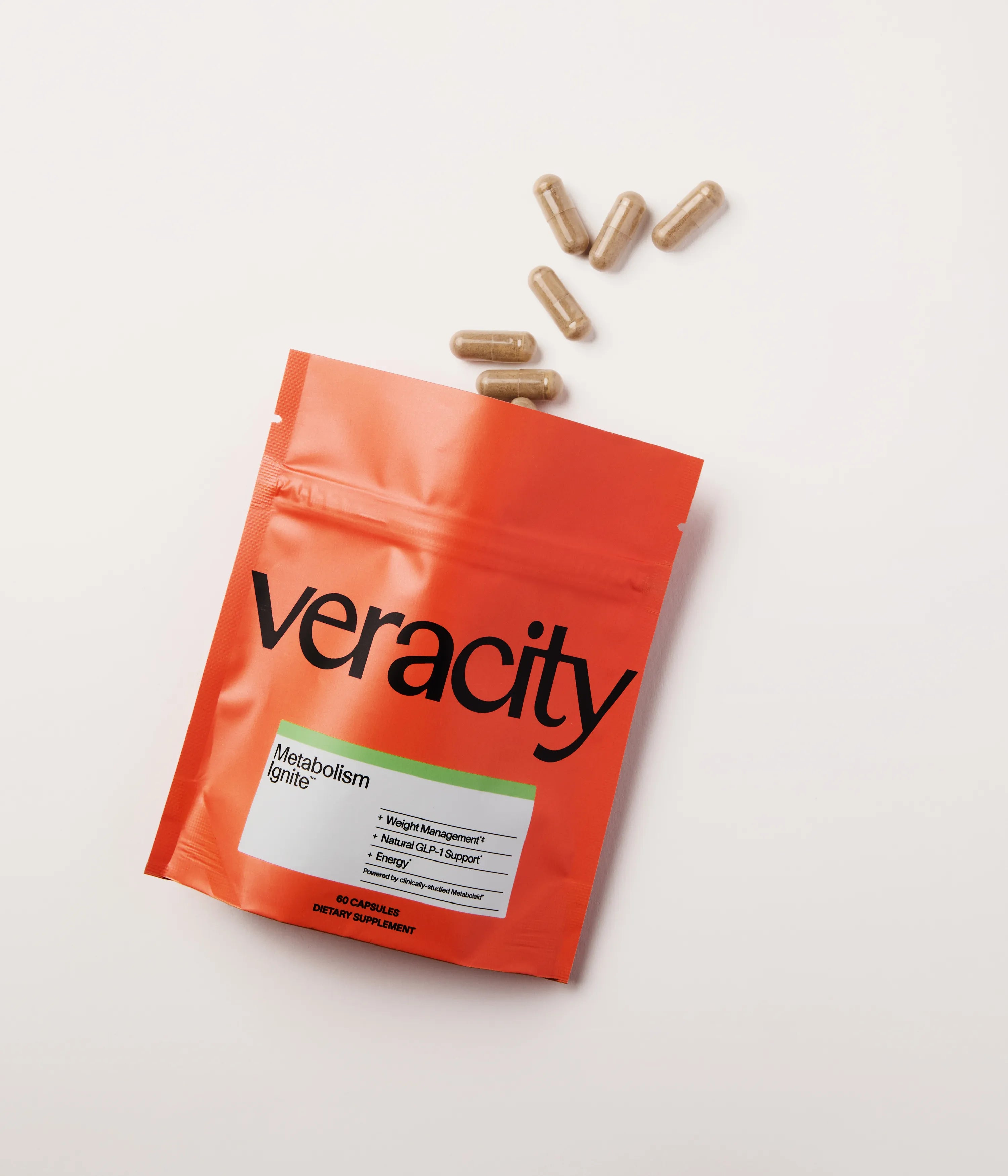 Metabolism-Ignite-Pouch-Capsules-Spill (2).webp